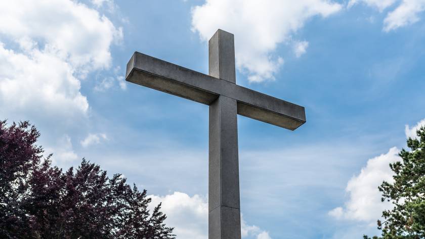 a large concrete cross on a cemetery against a blu 2025 03 12 22 25 26 utc
