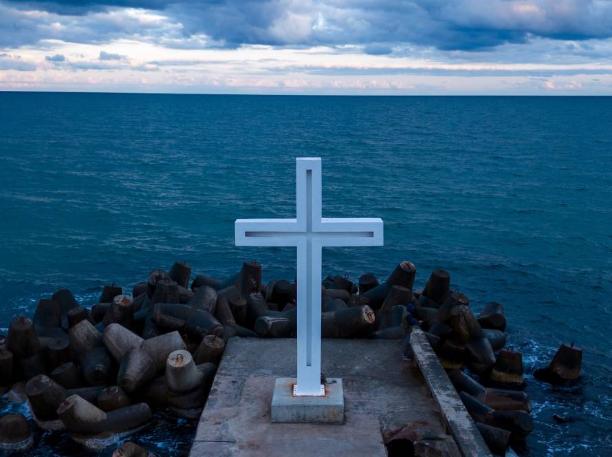 a large christian cross stands at the edge of a pi 2025 03 16 04 31 52 utc