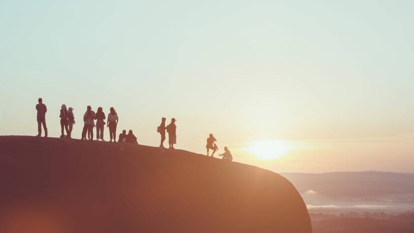 silhouette picture of people on mountain peak rock 2024 12 06 05 44 47 utc