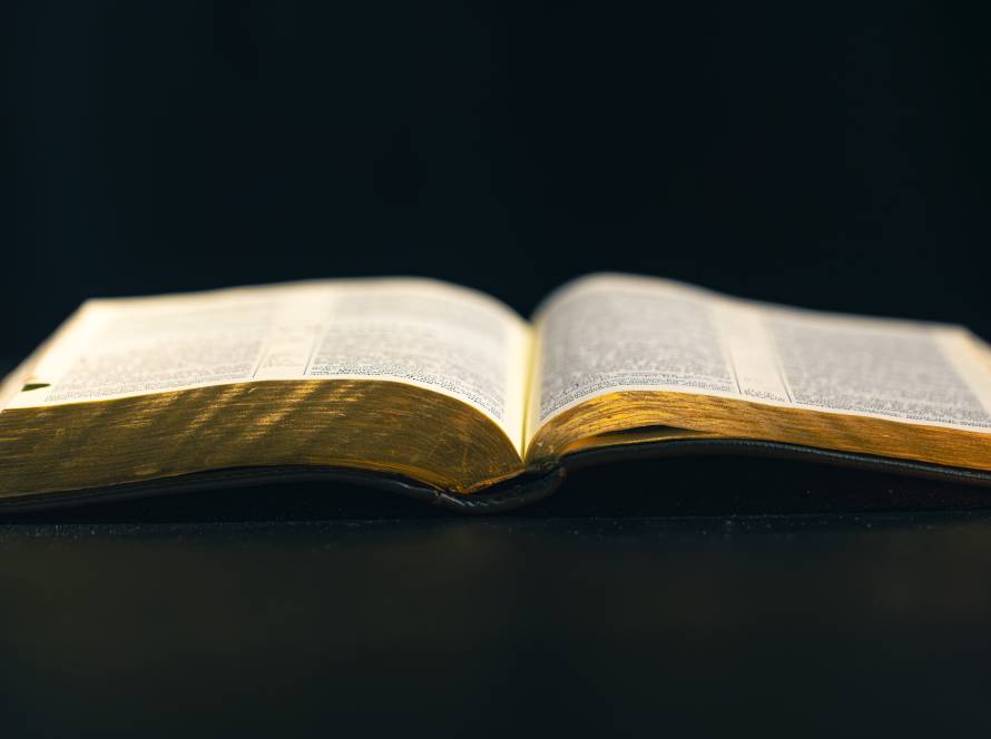 open bible on a black background religion concept 2025 03 16 04 36 28 utc